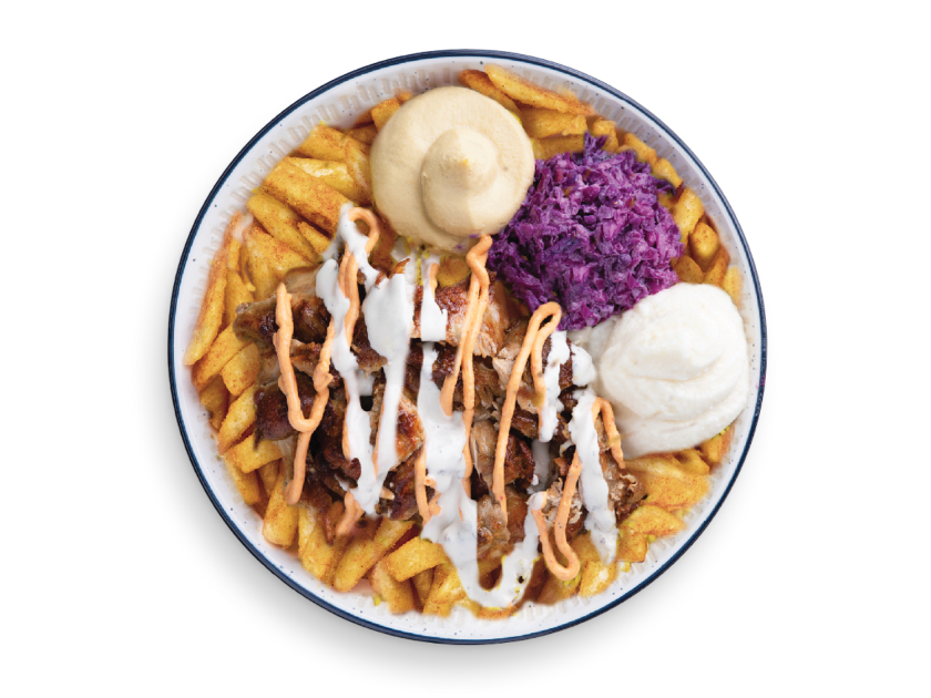 Chicken shawarma served over fries with tahini, parsley, tomatoes, pickles and garlic sauce