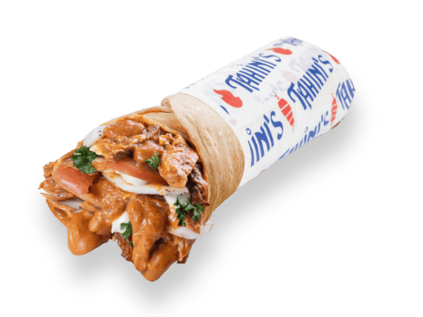 Chicken shawarma wrap rolled in saj bread with butter chicken sauce, onions, parsley, tomatoes and garlic sauce